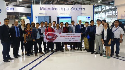 A delegation of Vietnamese customers on a tour of SCM plants and at Xylexpo